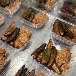 BBQ chicken and roasted potato wedges meals packed in compostable containers