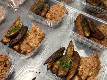 BBQ Chicken & Roasted Potato Wedges BBQ chicken and roasted potato wedges meals packed in compostable containers